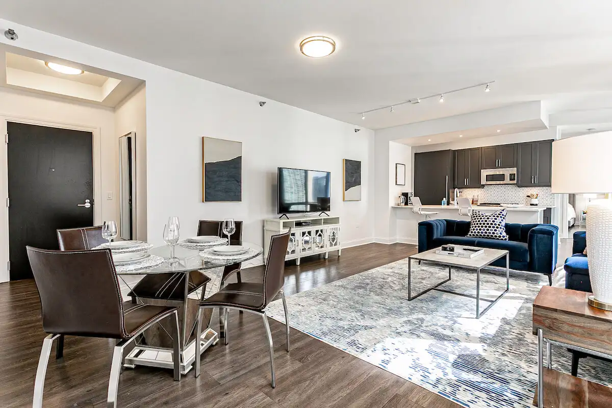 Group of professionals enjoying a luxury furnished corporate apartment in Downtown Chicago.