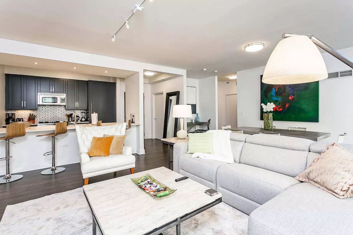 Group of professionals enjoying a luxury furnished corporate apartment in Downtown Chicago.