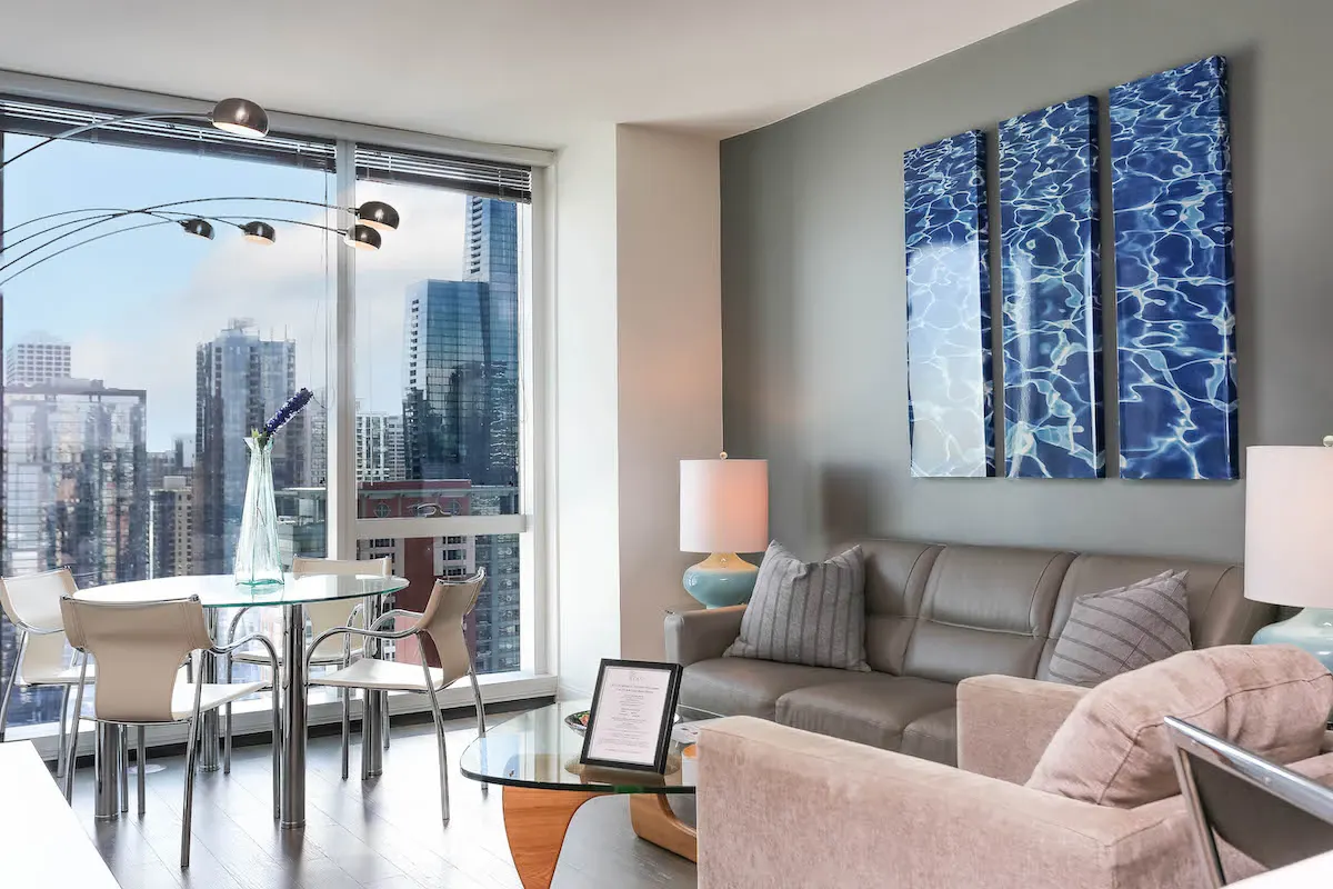 Group of professionals enjoying a luxury furnished corporate apartment in Downtown Chicago.