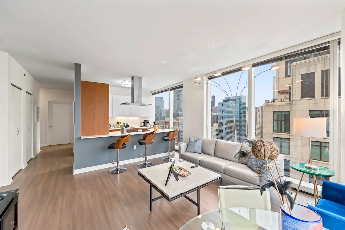 Group of professionals enjoying a luxury furnished corporate apartment in Downtown Chicago.