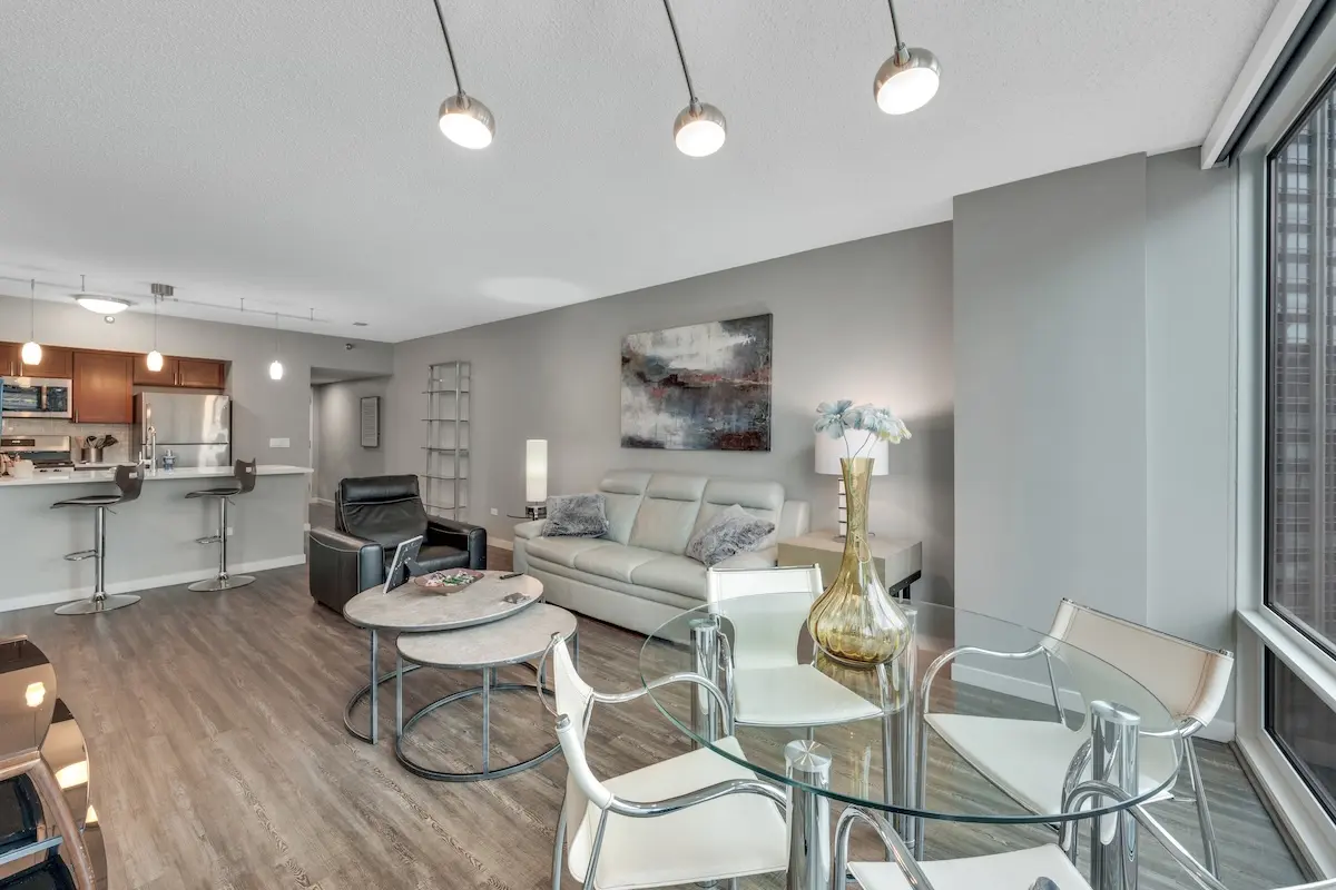 Group of professionals enjoying a luxury furnished corporate apartment in Downtown Chicago.