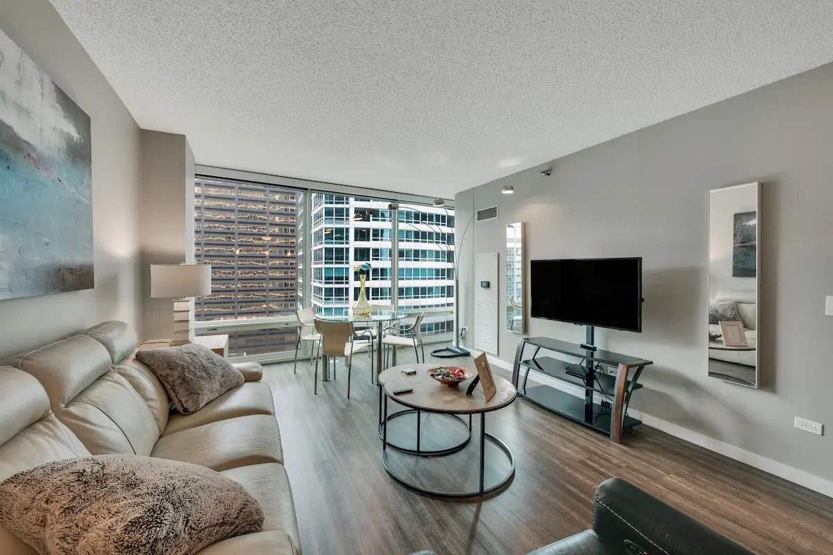 Group of professionals enjoying a luxury furnished corporate apartment in Downtown Chicago.