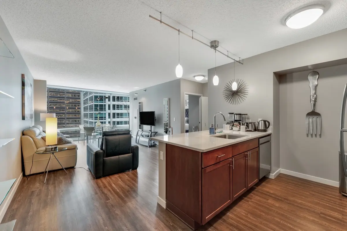 Group of professionals enjoying a luxury furnished corporate apartment in Downtown Chicago.