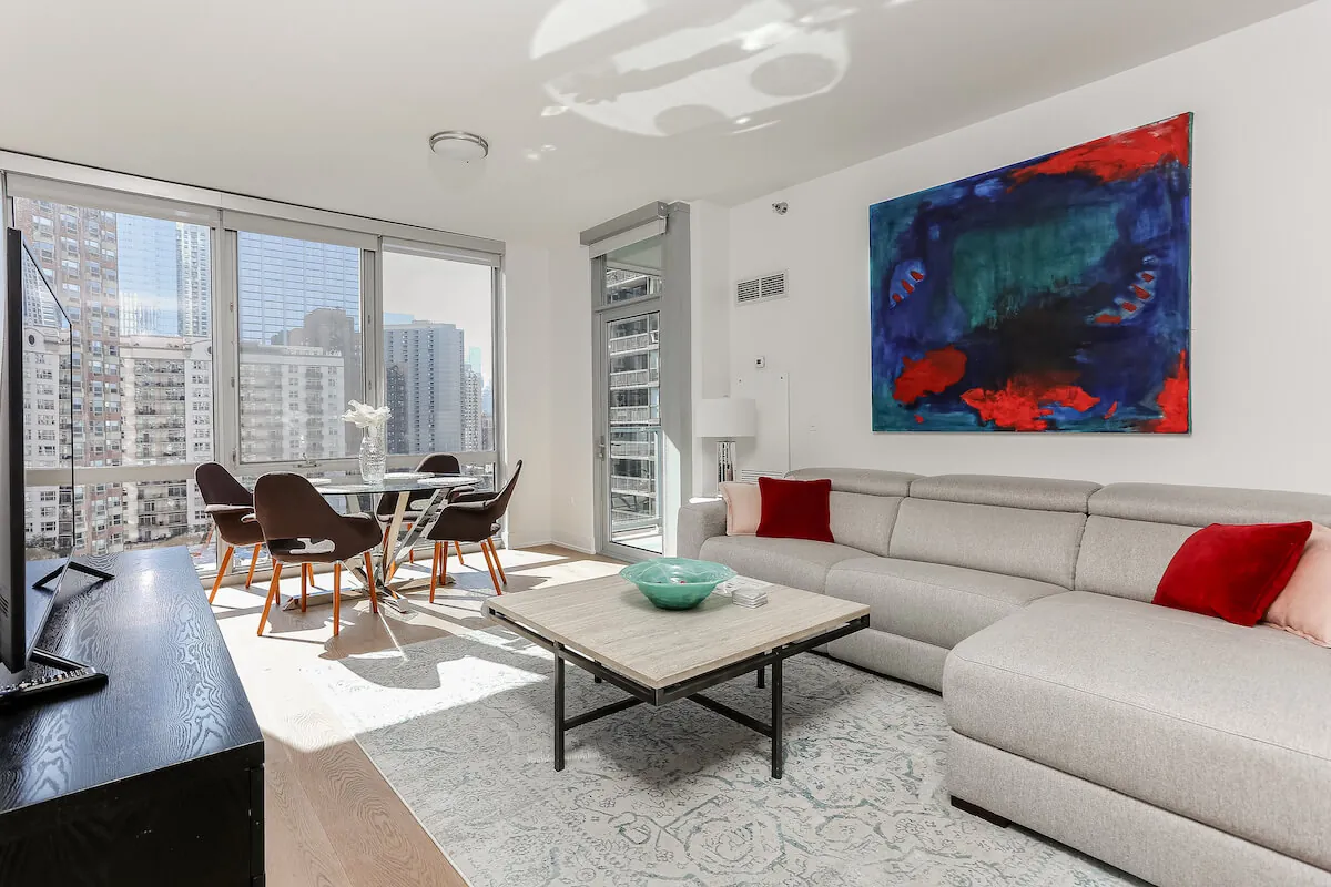 Modern fully furnished apartment with stylish bedroom and living space representing nearby move-in-ready rentals.