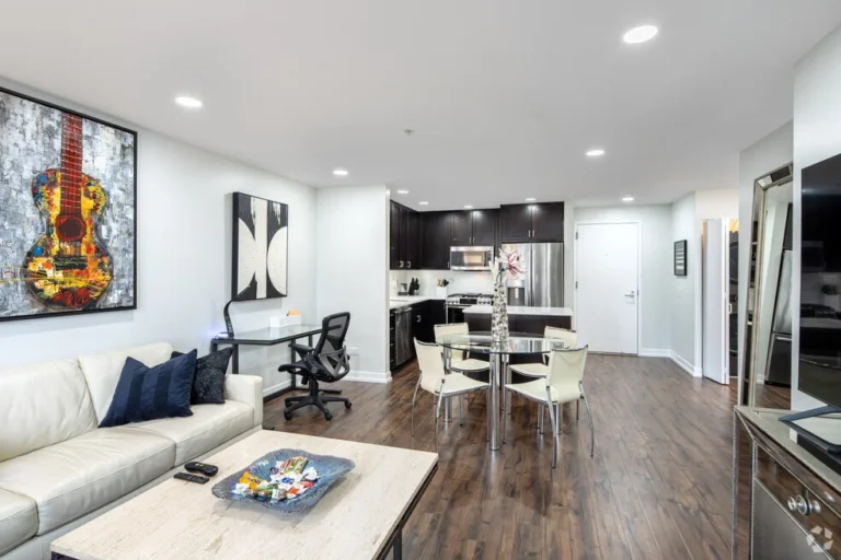 Chicago furnished apartment with a modern kitchen, workspace, and living room in River North.