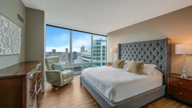 Luxury furnished bedroom in Chicago with skyline views, ideal for short-term rentals and extended stays.