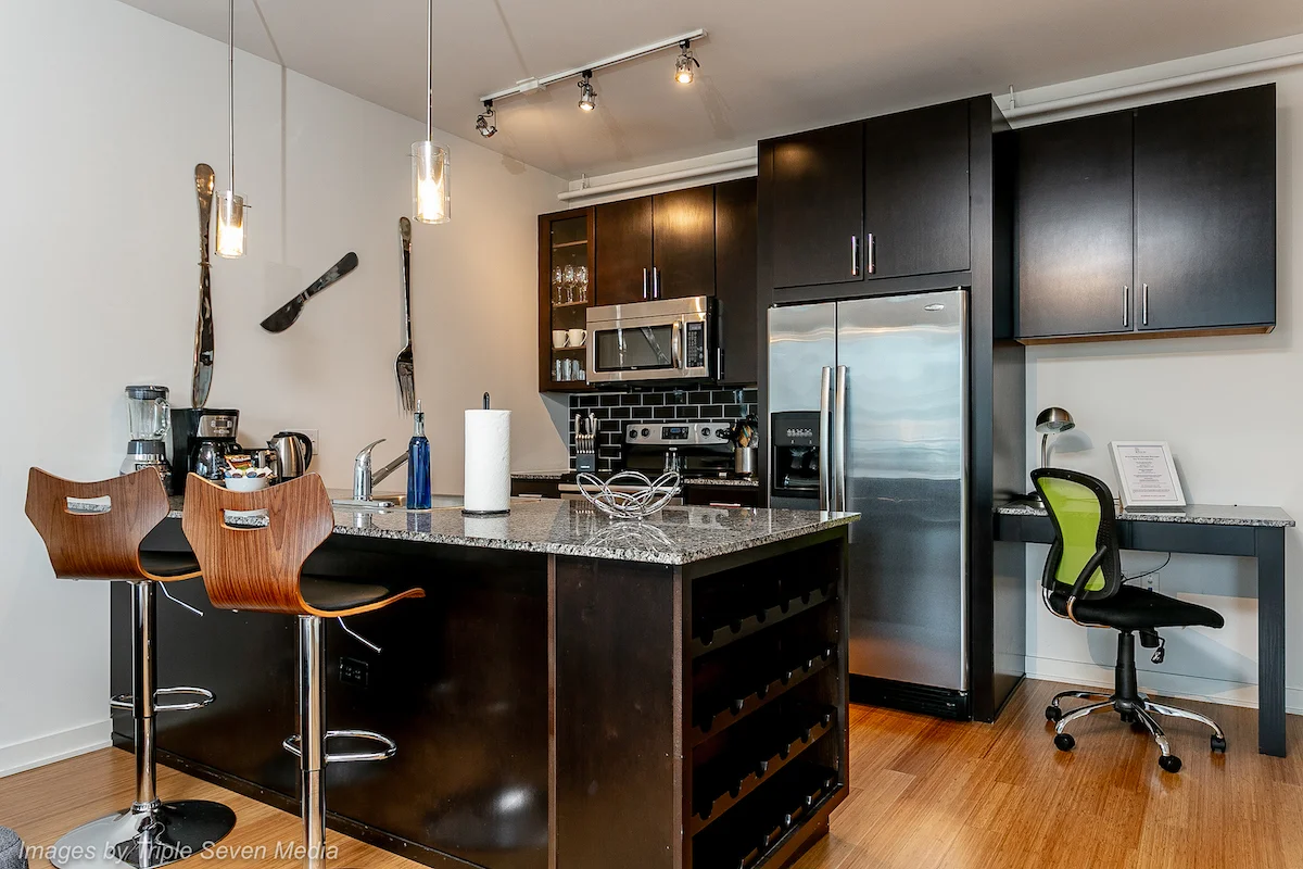 Modern furnished apartment kitchen in Chicago used for temporary housing and short-term rentals.