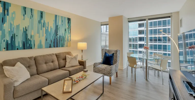 Modern corporate housing apartment in Chicago showing luxury furnished living space and amenities.