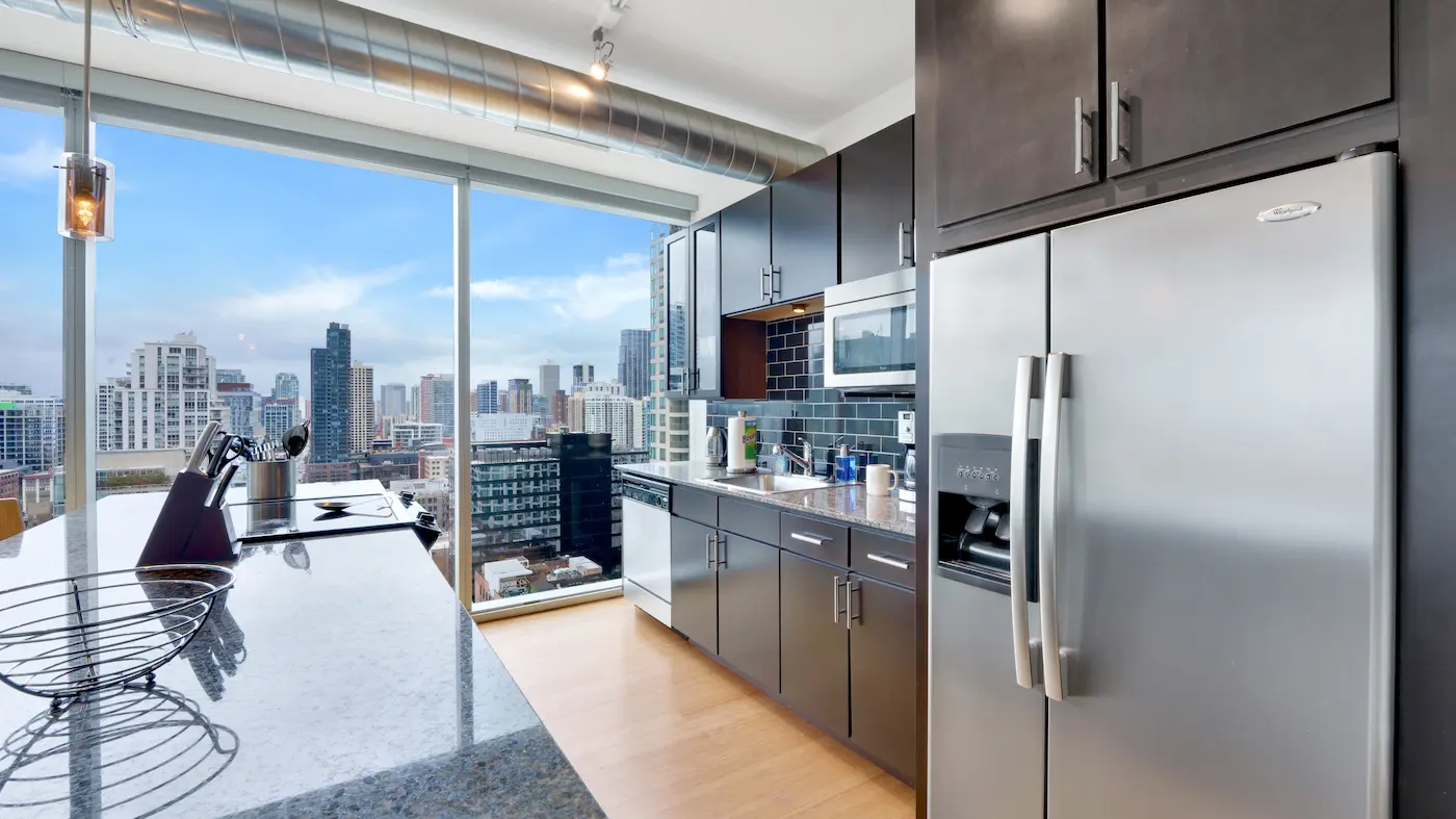 Group of professionals enjoying a luxury furnished corporate apartment in Downtown Chicago.