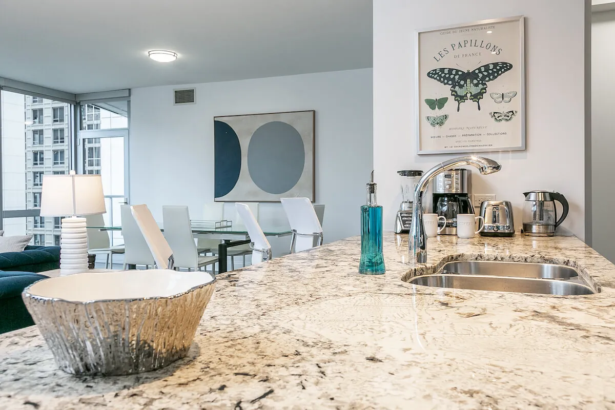 Modern fully furnished apartment with a fully stock kitchen representing move-in-ready rentals nearby.