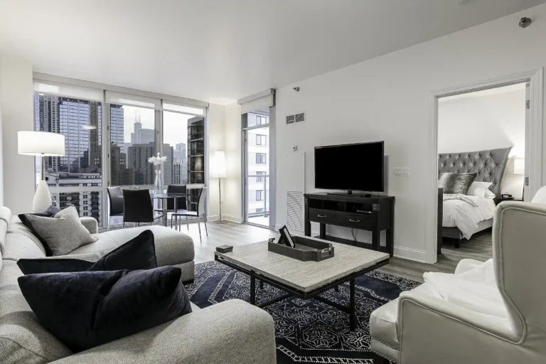 Luxury furnished short-term rental apartment in Chicago with modern living room design and skyline views.