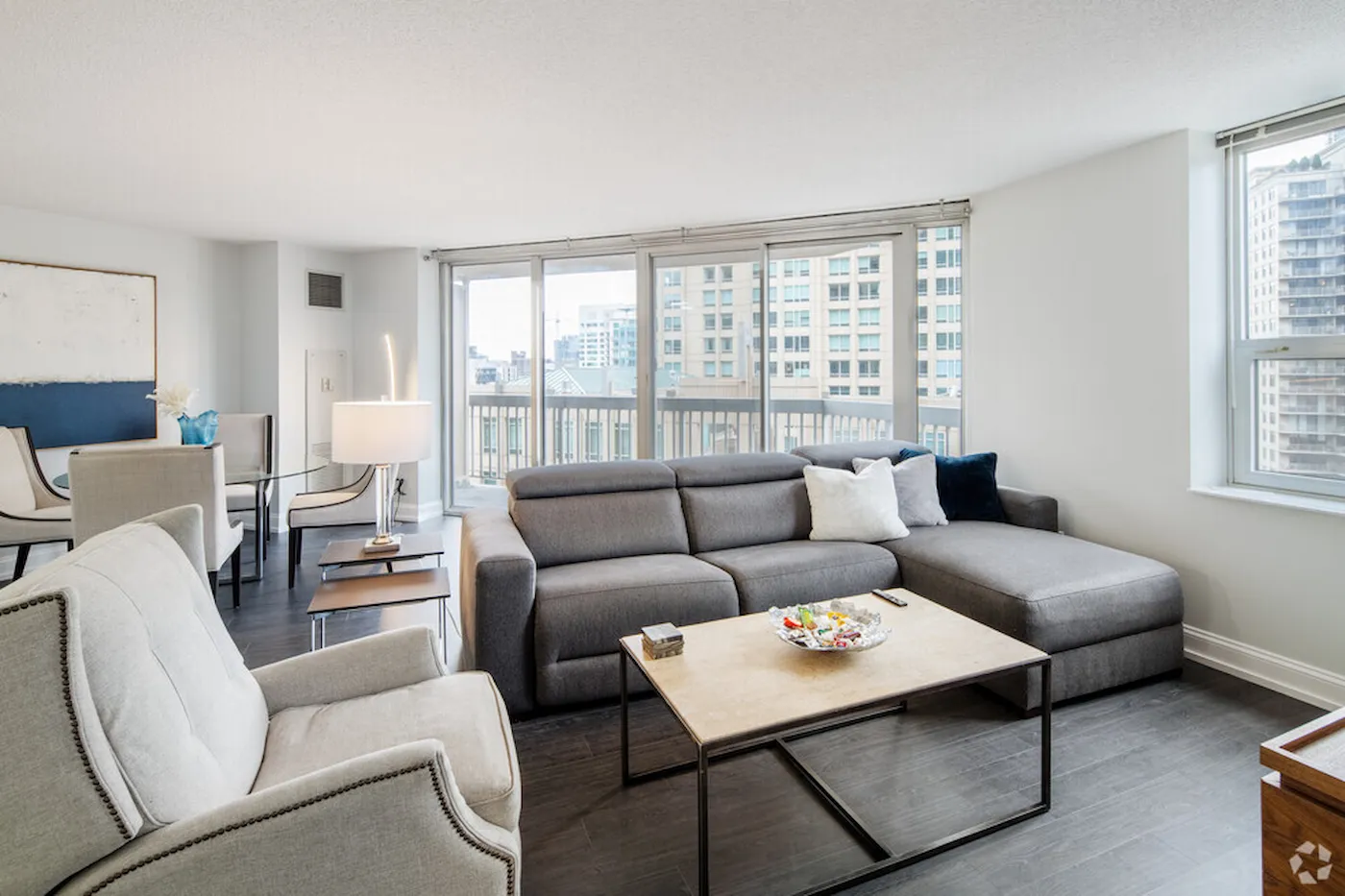 Group of professionals enjoying a luxury furnished corporate apartment in Downtown Chicago.