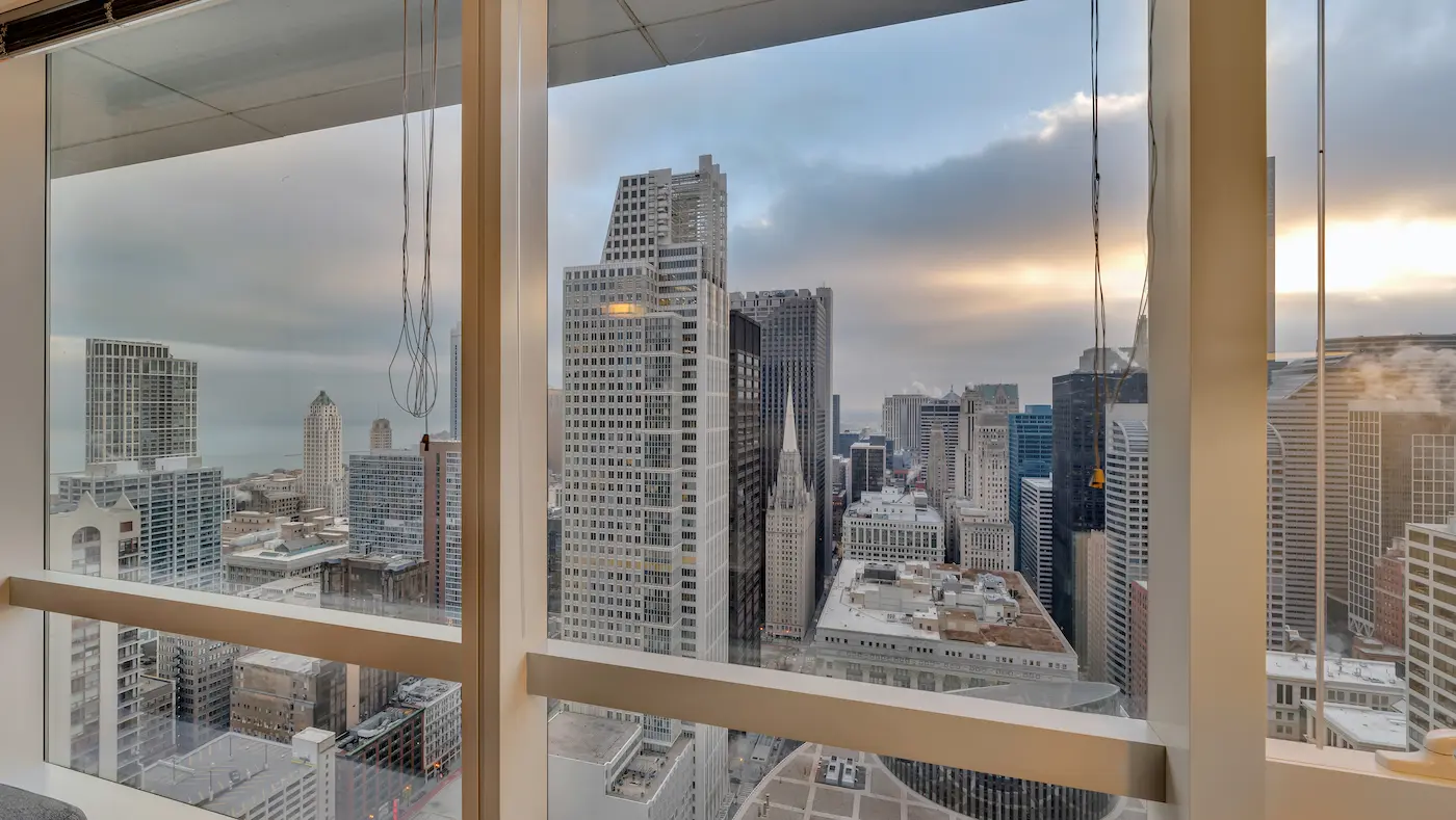Group of professionals enjoying a luxury furnished corporate apartment in Downtown Chicago.