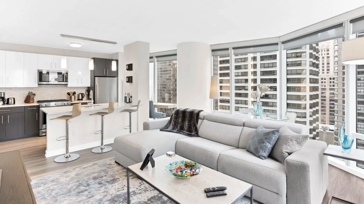 Group of professionals enjoying a luxury furnished corporate apartment in Downtown Chicago.