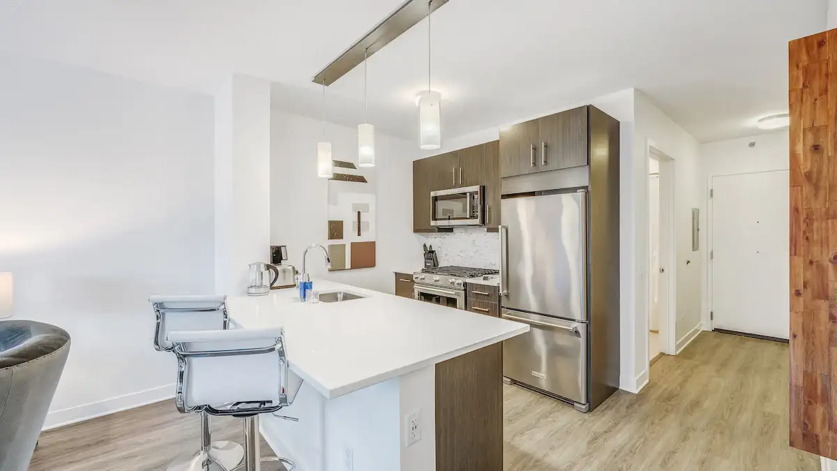 Group of professionals enjoying a luxury furnished corporate apartment in Downtown Chicago.