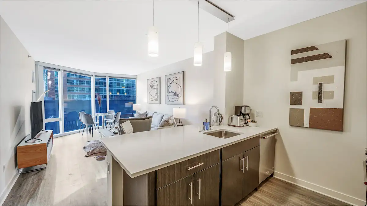 Group of professionals enjoying a luxury furnished corporate apartment in Downtown Chicago.