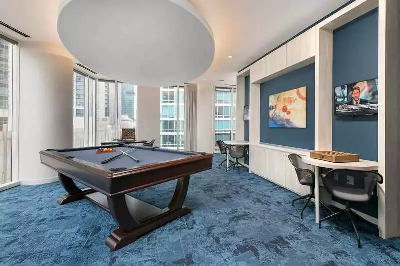 Group of professionals enjoying a luxury furnished corporate apartment in Downtown Chicago.