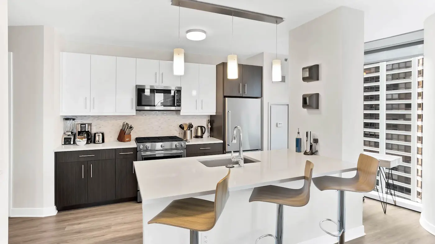 Group of professionals enjoying a luxury furnished corporate apartment in Downtown Chicago.