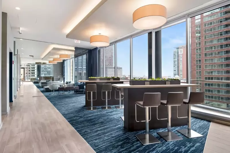 Group of professionals enjoying a luxury furnished corporate apartment in Downtown Chicago.