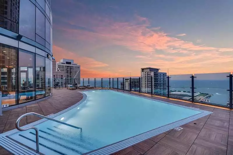 Group of professionals enjoying a luxury furnished corporate apartment in Downtown Chicago.