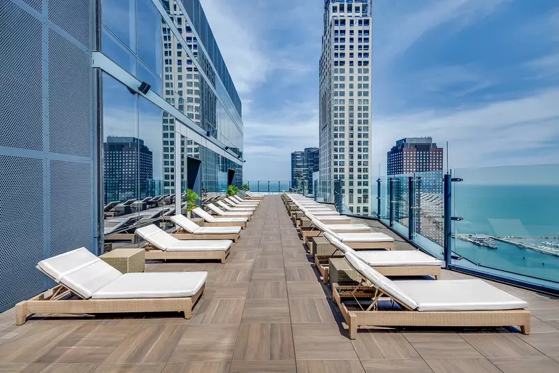 Group of professionals enjoying a luxury furnished corporate apartment in Downtown Chicago.