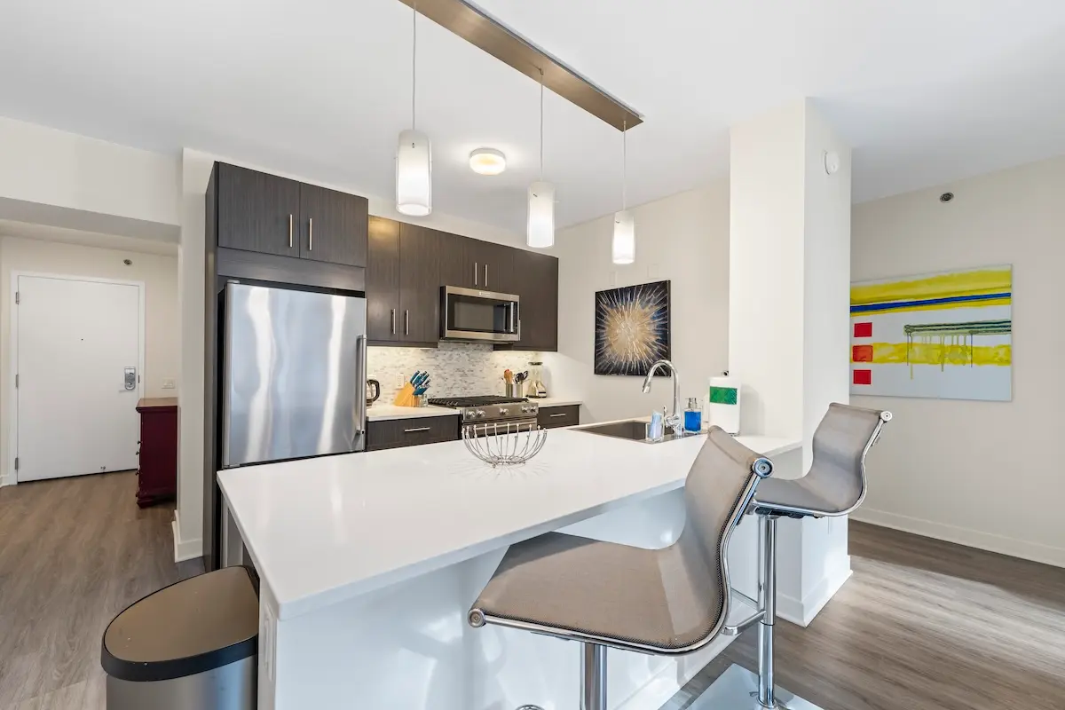 Group of professionals enjoying a luxury furnished corporate apartment in Downtown Chicago.