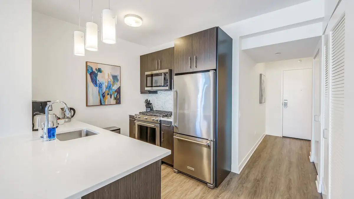 Group of professionals enjoying a luxury furnished corporate apartment in Downtown Chicago.