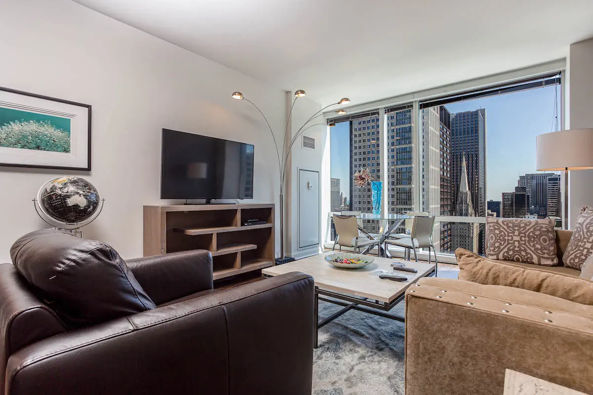 Group of professionals enjoying a luxury furnished corporate apartment in Downtown Chicago.