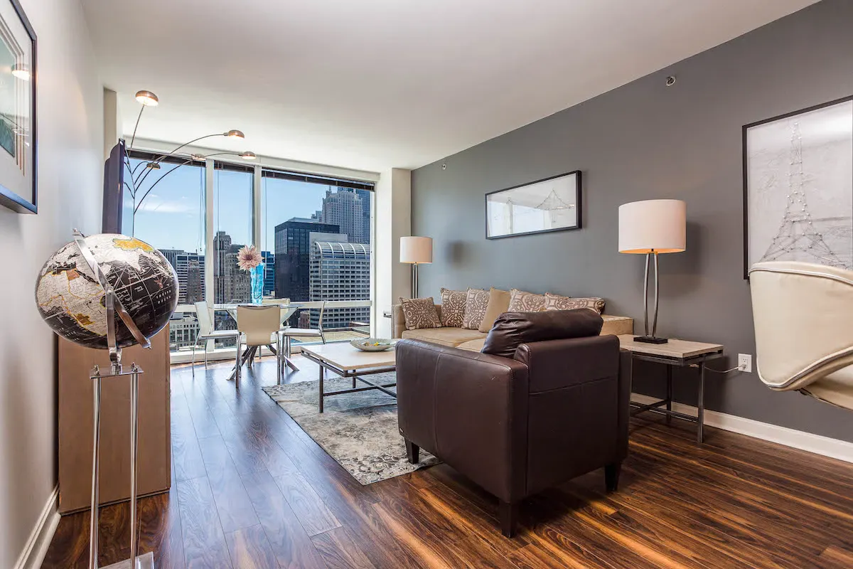 Group of professionals enjoying a luxury furnished corporate apartment in Downtown Chicago.