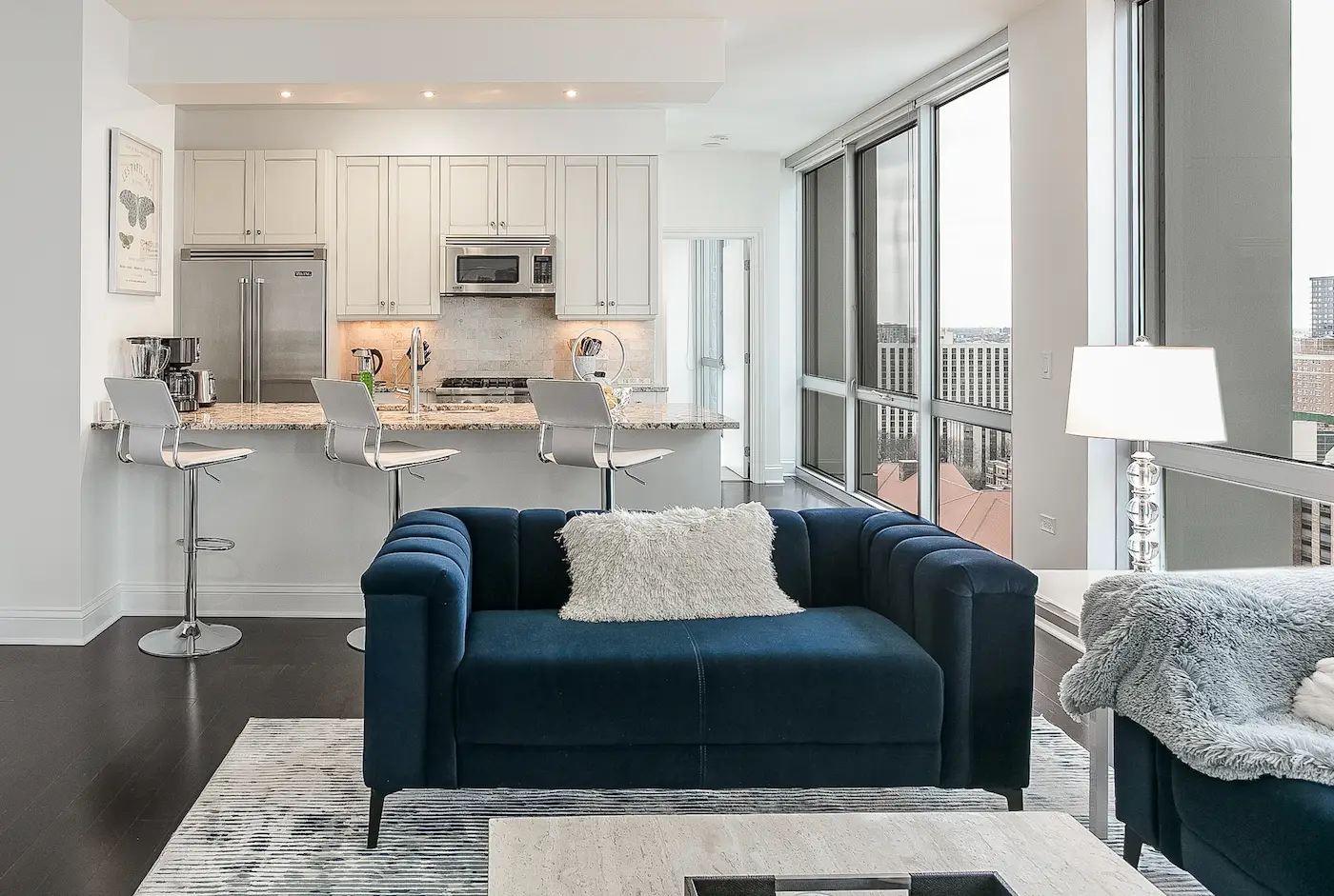 Group of professionals enjoying a luxury furnished corporate apartment in Downtown Chicago.