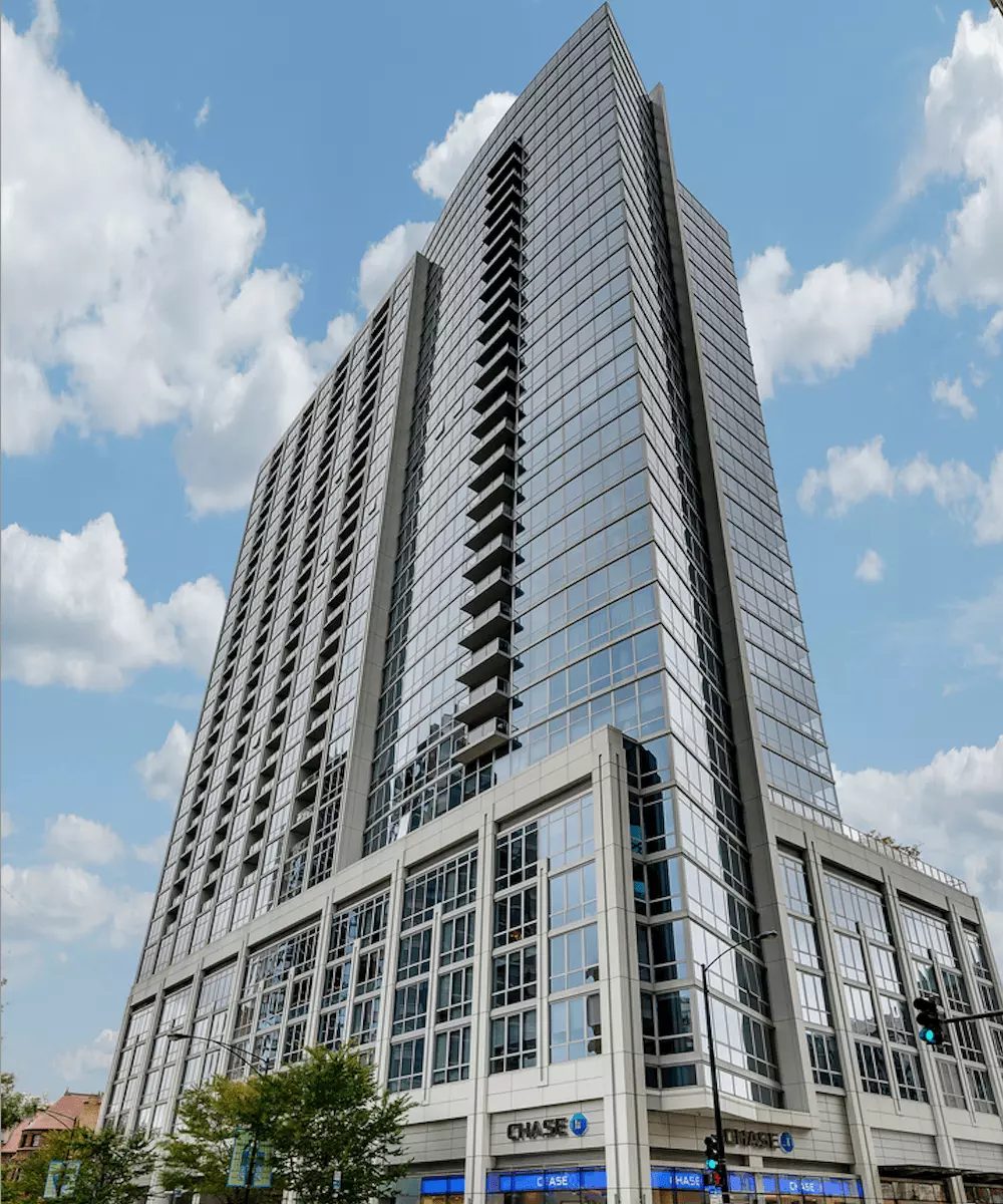 Group of professionals enjoying a luxury furnished corporate apartment in Downtown Chicago.