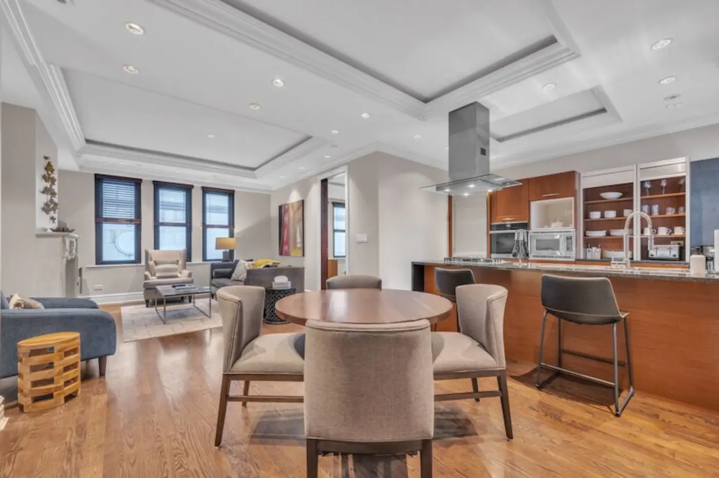 Group of professionals enjoying a luxury furnished corporate apartment in Downtown Chicago.