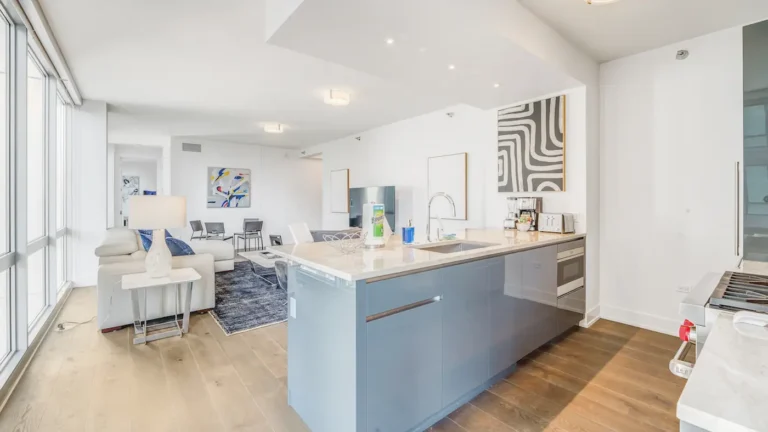 Fully furnished corporate housing apartment with living room and kitchen