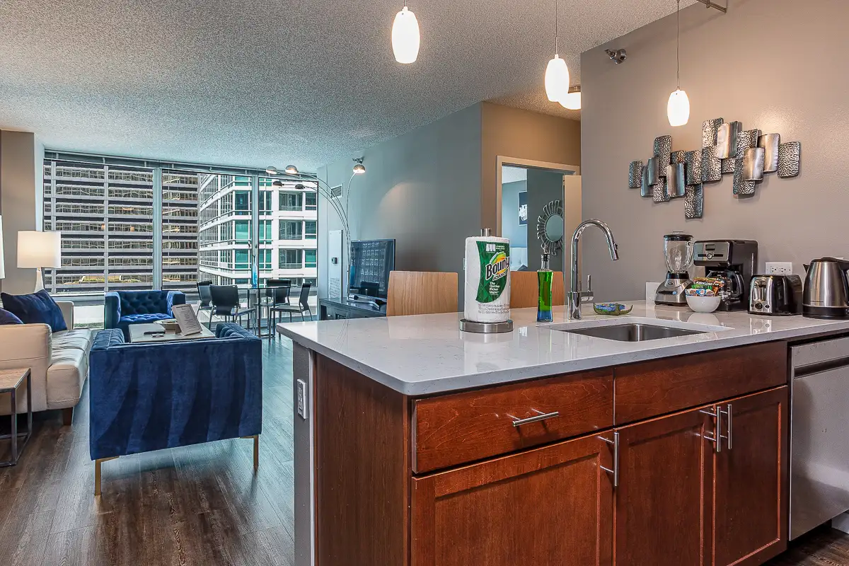 Group of professionals enjoying a luxury furnished corporate apartment in Downtown Chicago.