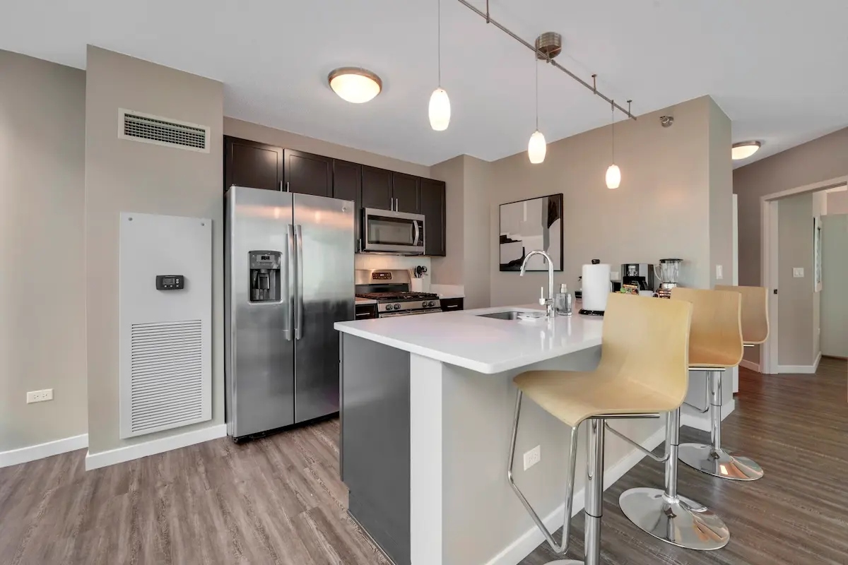 Group of professionals enjoying a luxury furnished corporate apartment in Downtown Chicago.