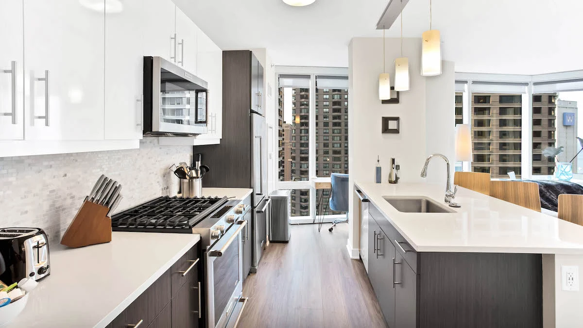 Group of professionals enjoying a luxury furnished corporate apartment in Downtown Chicago.