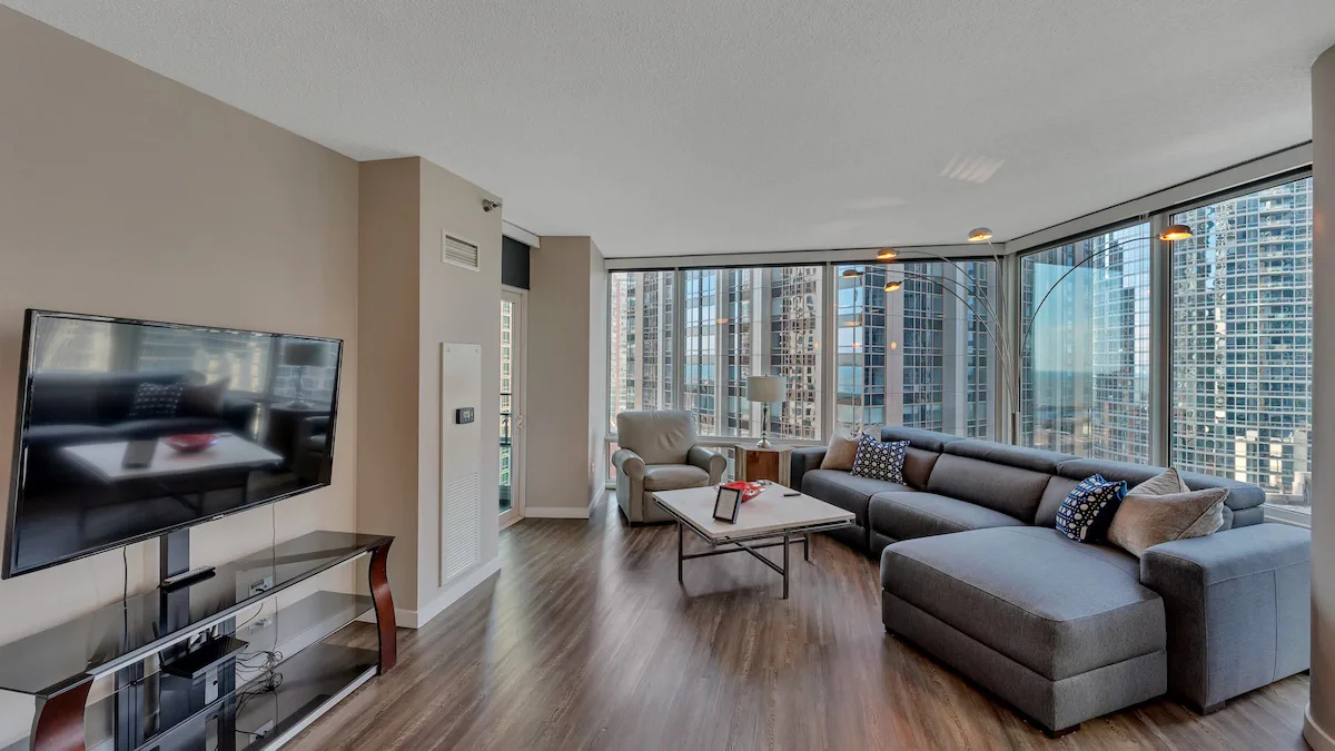 Group of professionals enjoying a luxury furnished corporate apartment in Downtown Chicago.