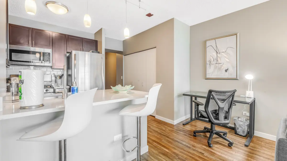 Group of professionals enjoying a luxury furnished corporate apartment in Downtown Chicago.