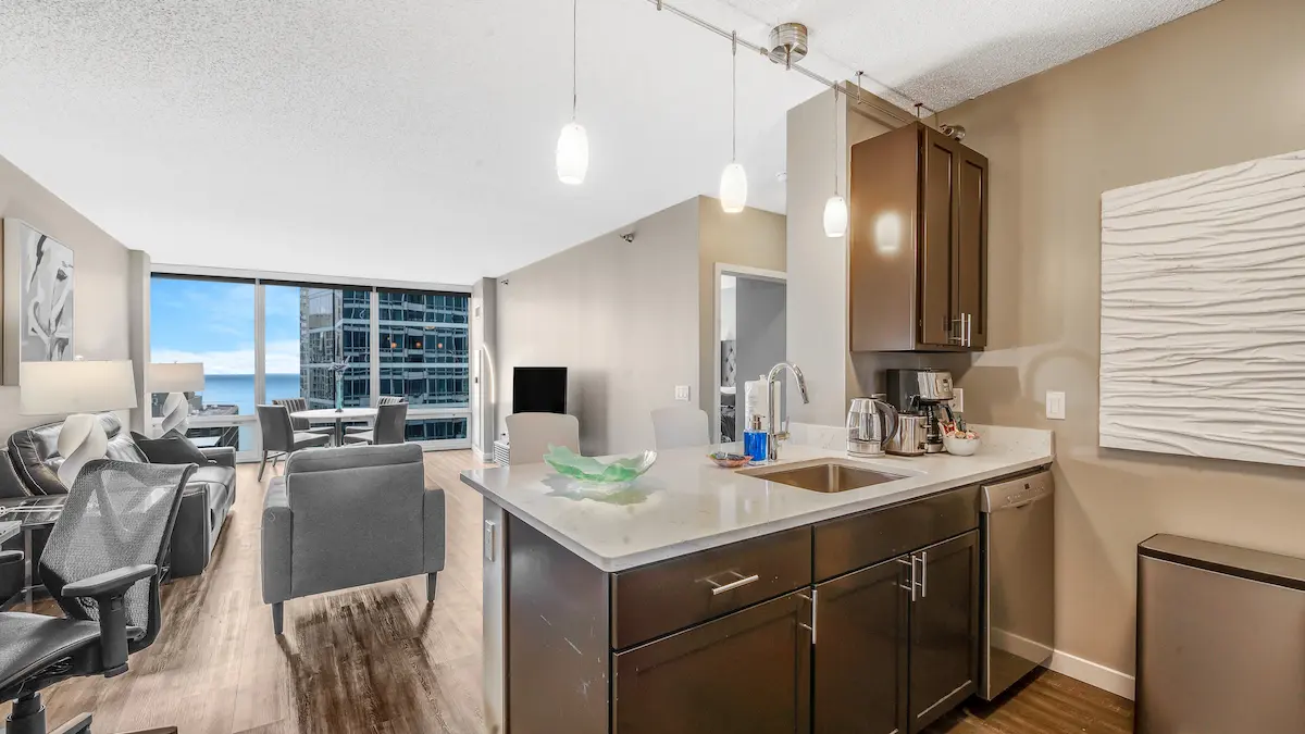 Group of professionals enjoying a luxury furnished corporate apartment in Downtown Chicago.