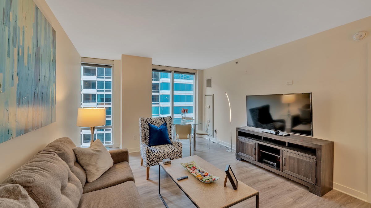 Group of professionals enjoying a luxury furnished corporate apartment in Downtown Chicago.