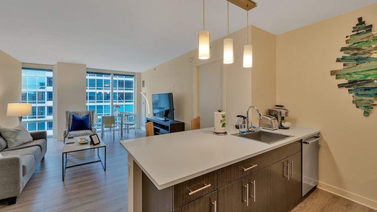Group of professionals enjoying a luxury furnished corporate apartment in Downtown Chicago.